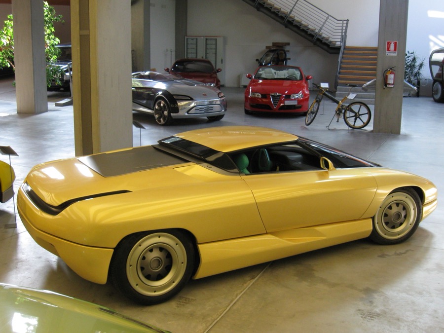 The 1990 Bertone Nivola concept, a bright yellow mid-engine Corvette-based coupe